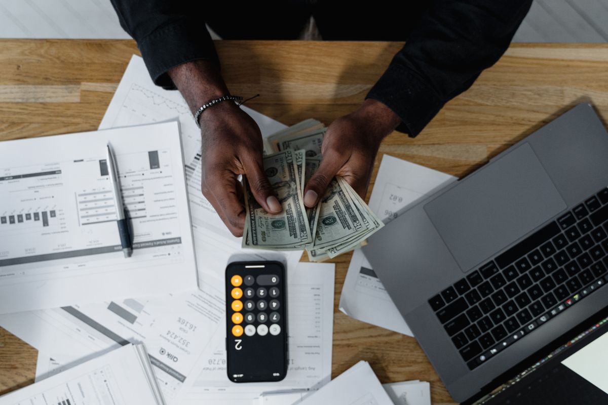 Is gratuity calculated on basic salary in Qatar - worker checking salary documents